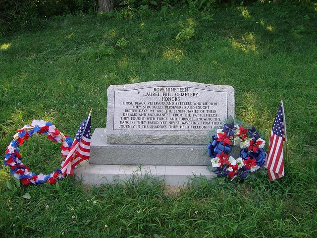 Memorial marker stating: Row Nineteen Laurel Hill Cemetery Honors those black veterans and settlers who lie here.